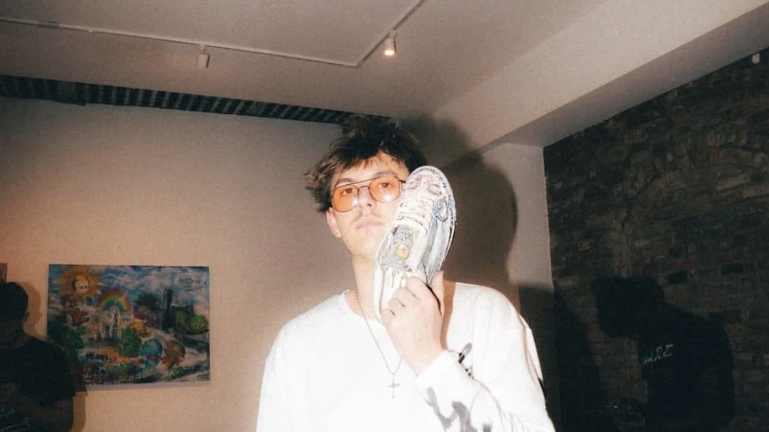At a gallery show, with a hand-painted shoe