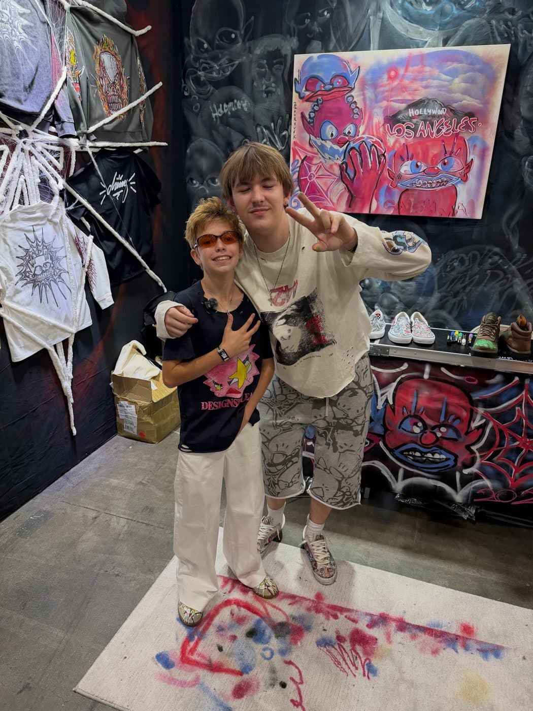 Hemsley with a visitor under the Los Angeles painting
