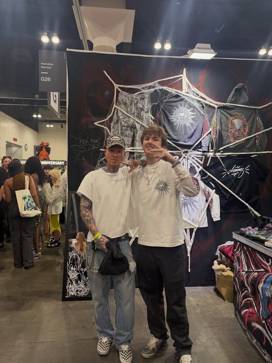 Hemsley with a visitor at the booth