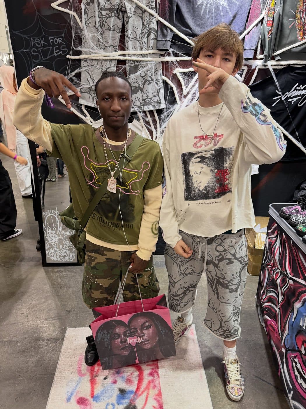 Hemsley with a visitor at the booth