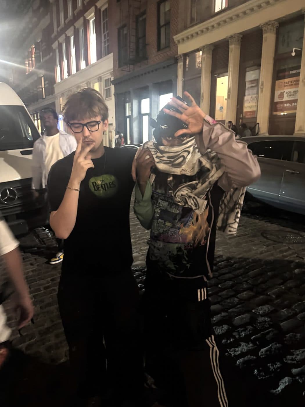 Hemsley and a friend on the street at night