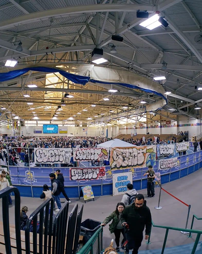 Select Markets: vendors and graffiti banners around an indoor track
